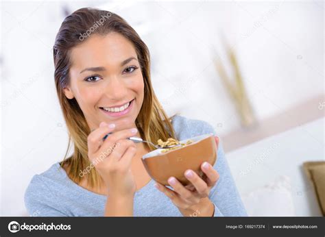 Young Woman Eating Cereals Stock Photo By ©photography33 169217374