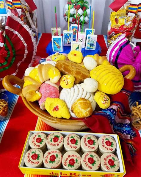 A Table Topped With Lots Of Cupcakes And Cookies