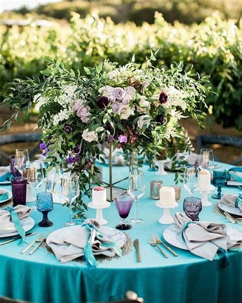 The Vases At These Turquoise Tables Were Overflowing Of Greenery
