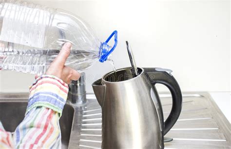 Pouring Water In Kettle Stock Photo Image Of Flask Cropped 82176644