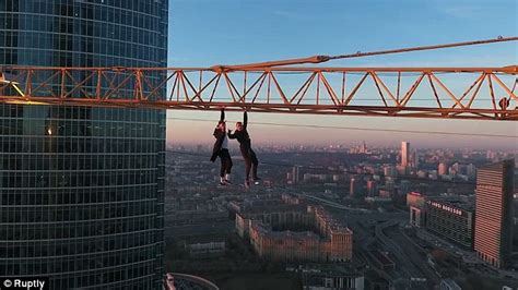 Terrifying Video Shows Russian Pair Hanging From A Crane Above Moscow