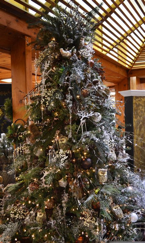 The Nature Themed Christmas Tree Features Earth Tone Ornaments And