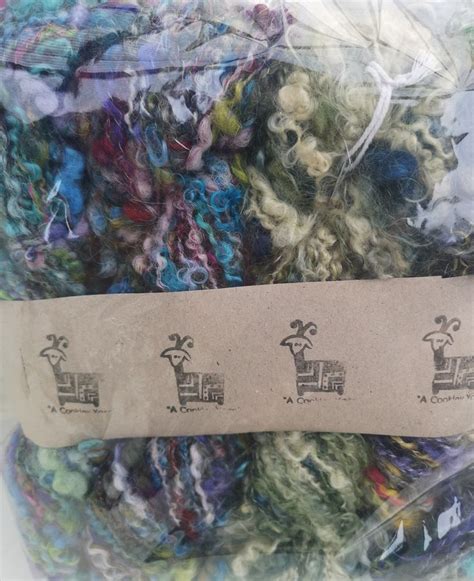 Several Skeins Of Yarn Are Wrapped In Plastic Bags And Labeled With The