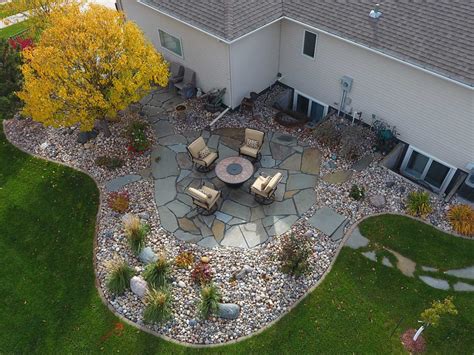 Large Stone Patio With Colorful Rock Bed Edging Oasis Landscapes