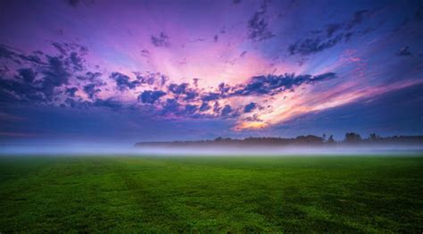 1024x520 Green Grass And Fogg Under Purple Sky During Sunset 1024x520
