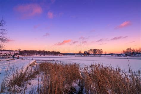 View Of A Frozen Lake During Sunrise In Winter Season Stock Image