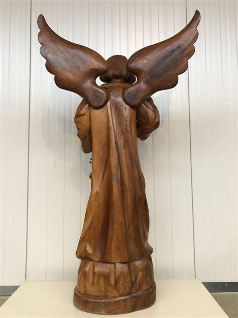 Large Angel Carved In Wood Hetverbodenbeeld
