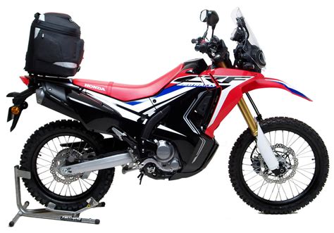 The crf250l rally takes the existing honda dual sport and adds radiator shrouds, a cute asymmetrical led headlight, and a floating screen. Honda CRF 250L Rally Gets The Ventura Bike-Pack Luggage ...