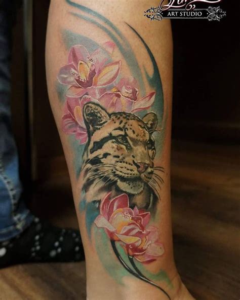 Watercolor tattoo helps to express watercolor tattoo is one of the best idea to get tattoo on your body. #leopardtattoo #cloudedleopardtattoo #magnolia # ...