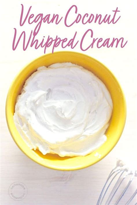 A Yellow Bowl Filled With Whipped Cream Next To A Whisk On Top Of A Table