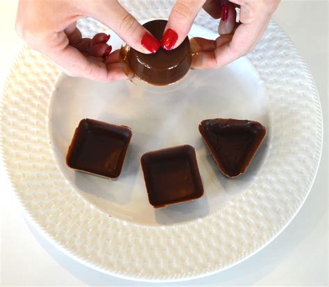 Remove the milk chocolate cups from fridge and carefully ease them out of their molds then peel off the plastic wrap. City Chocolates: Chocolate Mousse Cups