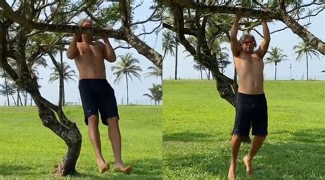 Milind Soman Exercises By Hanging From A Tree Branch Watch Video Aydintepemedya Com