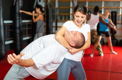 Woman Practising Neck Grabbing Move In Gym Stock Photo Image Of