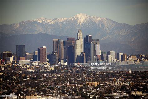 Los Angeles Skyline With Snow Capped Mountains High Res Stock Photo