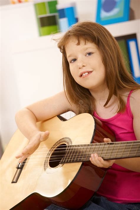 1025 Little Daughter Playing Guitar Stock Photos Free And Royalty Free