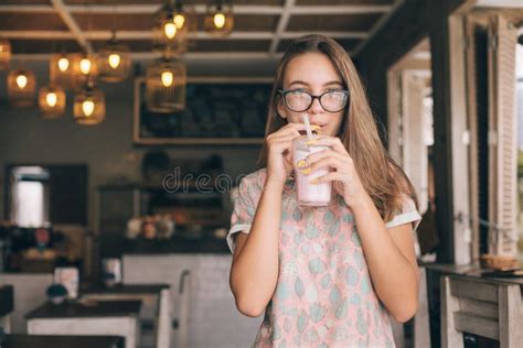 teen girl drinking smoothie in cafe stock image image of teen glasses 160357553