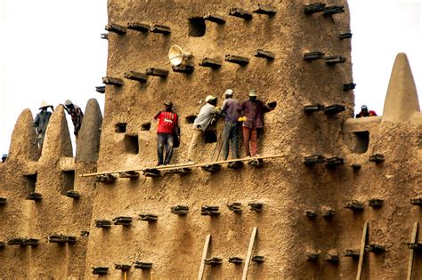 annual repair of the world s largest mud brick building t… flickr