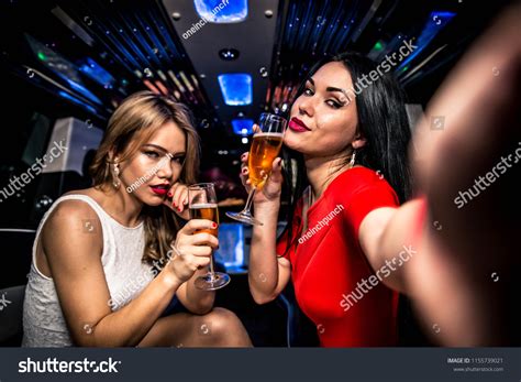 Pretty Women Having Party Limousine Car Stock Photo