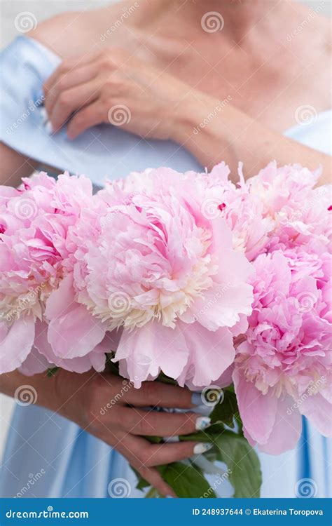 Bride In A Blue Wedding Dress With A Bouquet Of Pink Peonies Pastel