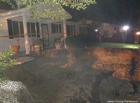 Massive 60 Foot Sinkhole Opens Up In Florida Neighborhood Prompting