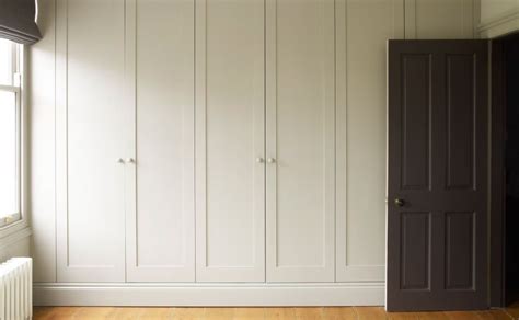 I.e., 150cm or 200cm wide and 235 high. Wall of floor-to-ceiling fitted wardrobes with traditional ...