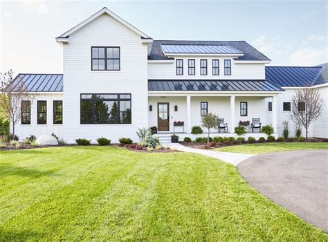 A ribbed metal roof caps this detached garage plan styled with farmhouse features for the utmost character. Modern Farmhouse - BCD Homes