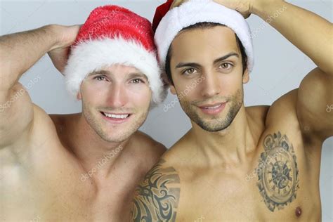 Two Sexy Men Wearing A Santa Hat Stock Photo By Rdrgraphe 87868954