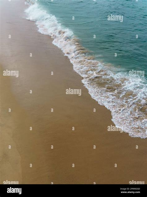 Areal View Of Ocean Wave Washing Up Onto Sandy Beach Stock Photo Alamy