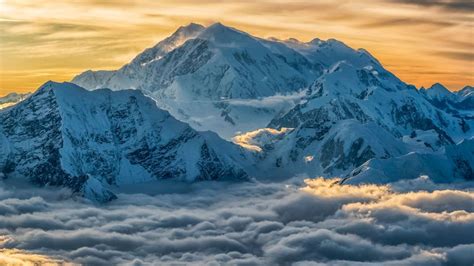Aerial Image Of Mount Logan Rising Above The Clouds In Kluane National