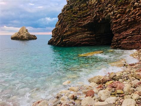 Free Images Beach Cave Clear Water Clouds Coast Daylight