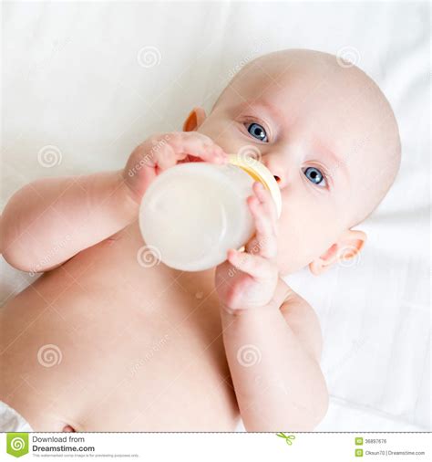 Baby Drinking From Bottle Stock Photo Image Of Action
