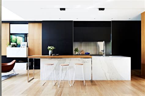 The white and black backsplash makes for a unique and admirable focal point in the kitchen and can team up with a decorative pendant light for a more peculiar style. Black, White & Wood Kitchens: Ideas & Inspiration