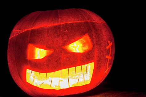 Glowing Scary Pumpkin Head Tilted Photograph By John Paul Cullen