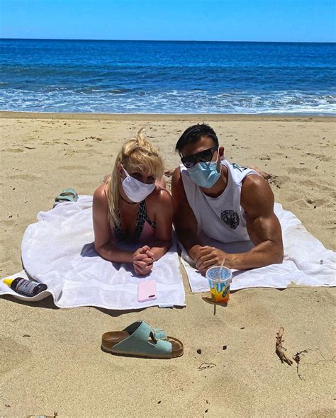 britney spears rocks bikini and mask as she gushes ‘all you need is love during beach date with