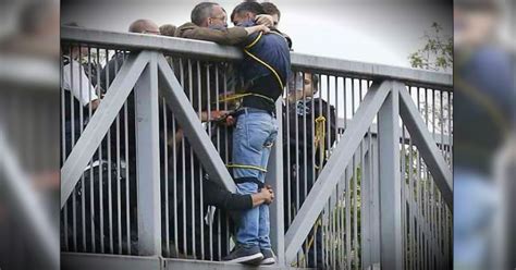 Suicidal Man Stopped From Jumping Off Bridge By A Group Of Strangers
