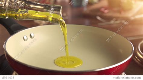 Pouring Mustard Oil Into Frying Pan Stock Video Footage 8961493