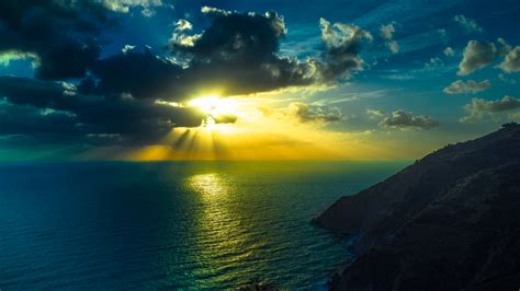 Download Sunbeam Ocean Sea Cloud Nature Sunset 4k Ultra Hd Wallpaper