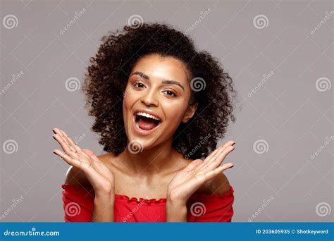 Happy Smiling African Woman With Afro Hairstyle Looking At Camera Stock