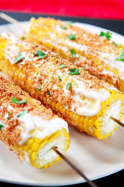 You can add some cheese, chili powder, and cilantro on top. Authentic Mexican Street Corn Recipe