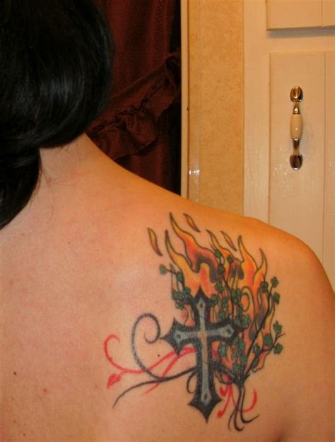 This tattoo includes a black and white inked tattoo of the virgin mary carrying baby jesus in her arms. 36 best Holy Spirit Flame Tattoo Design images on ...