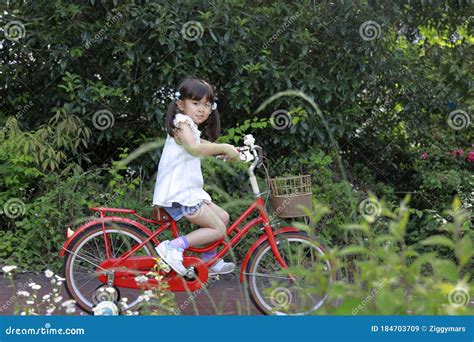 japanese girl riding on the bicycle stock image image of female smile 184703709