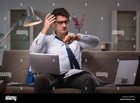 The businessman workaholic working late at home Stock Photo - Alamy