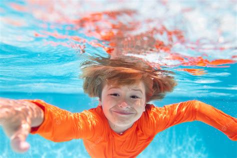 Premium Photo Child Swim And Dive Underwater In The Swimming Pool