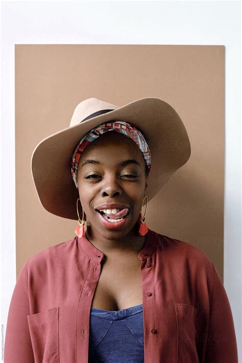 stylish black woman showing tongue by stocksy contributor clique images stocksy