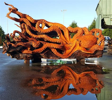 Artist Uses A Chainsaw To Transform A Fallen Redwood Tree Into A