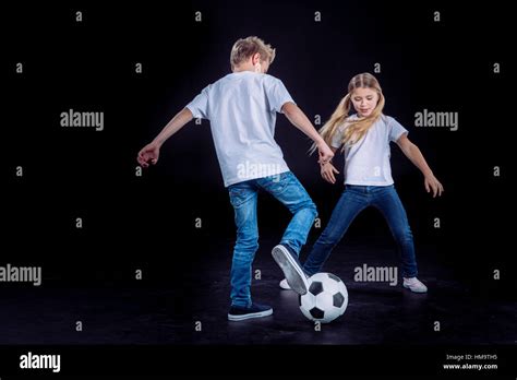 Brother And Sister Playing With Soccer Ball Stock Photo Alamy