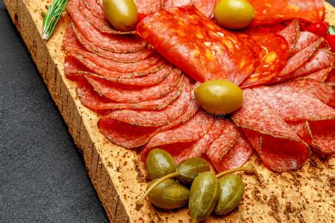 Cold Meat Plate With Salami And Chorizo Sausage On Cork Wood Board