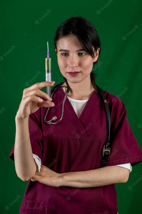 premium photo doctor nurse in medical mask and gloves holding syringe with vaccine typical