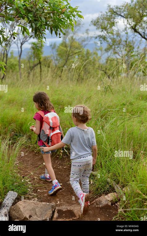 Two Children Walk Along A Path Through A Forest Mount Stuart Hiking