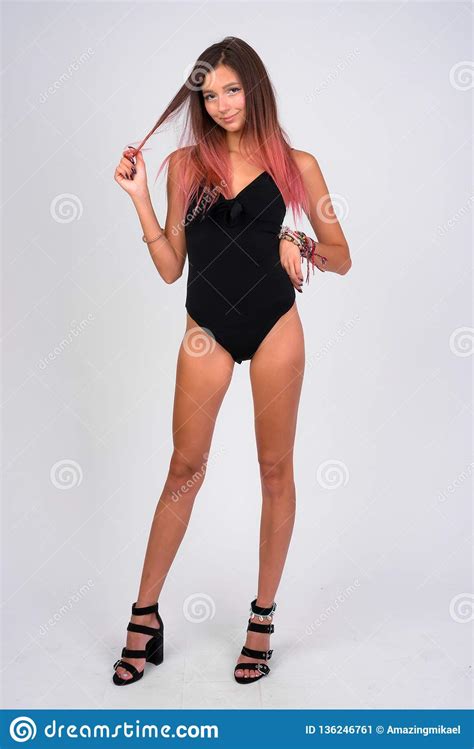 Full Body Shot Of Young Beautiful Woman In Swimsuit Stock
